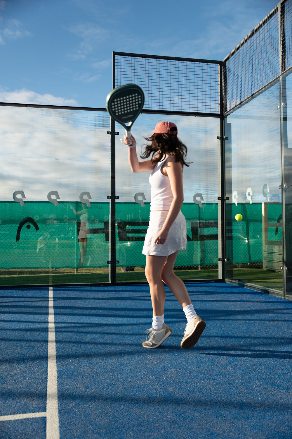 Player preparing a shot with an Ivory Green Paloma racket